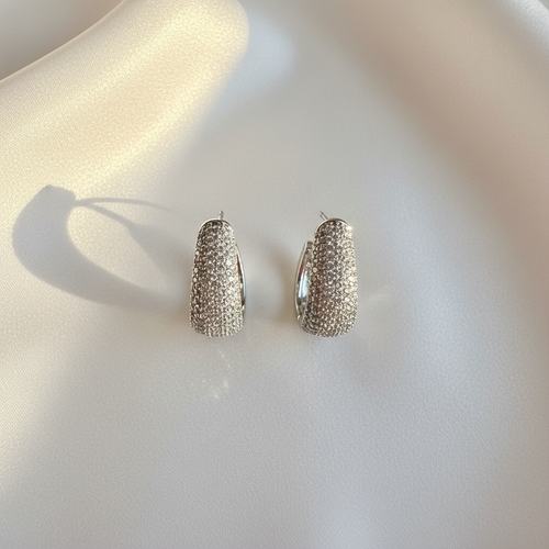 Aretes Iced Out Flat Lay