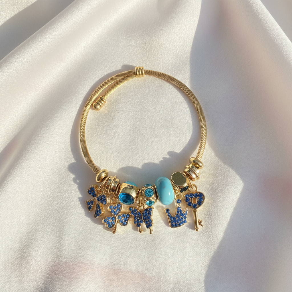 Blue Gold Charm Bracelet Flat Lay