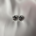 Double Heart Huggie Earrings Flat Lay