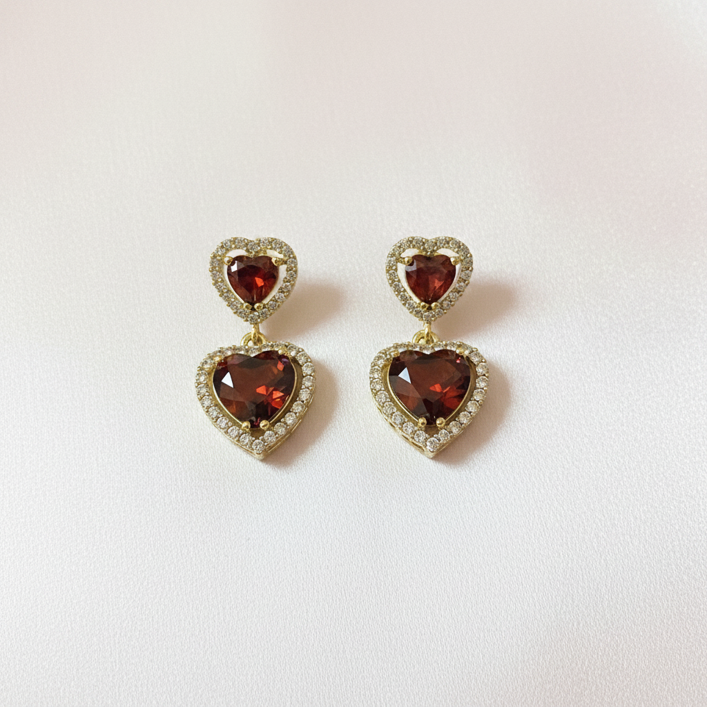 Gold Double Heart Drop Earrings Flat Lay