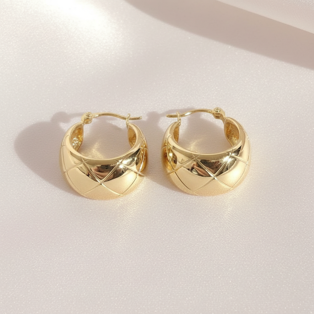 Gold Quilted Huggie Hoop Earrings Flat Lay