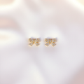 Iced-Out Bow Studs Flat Lay