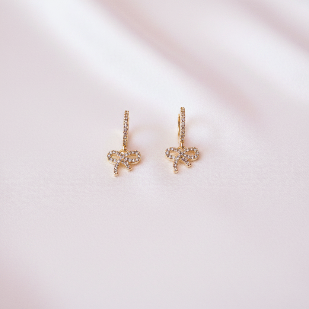 Open Bow Twisted Hoops Flat Lay