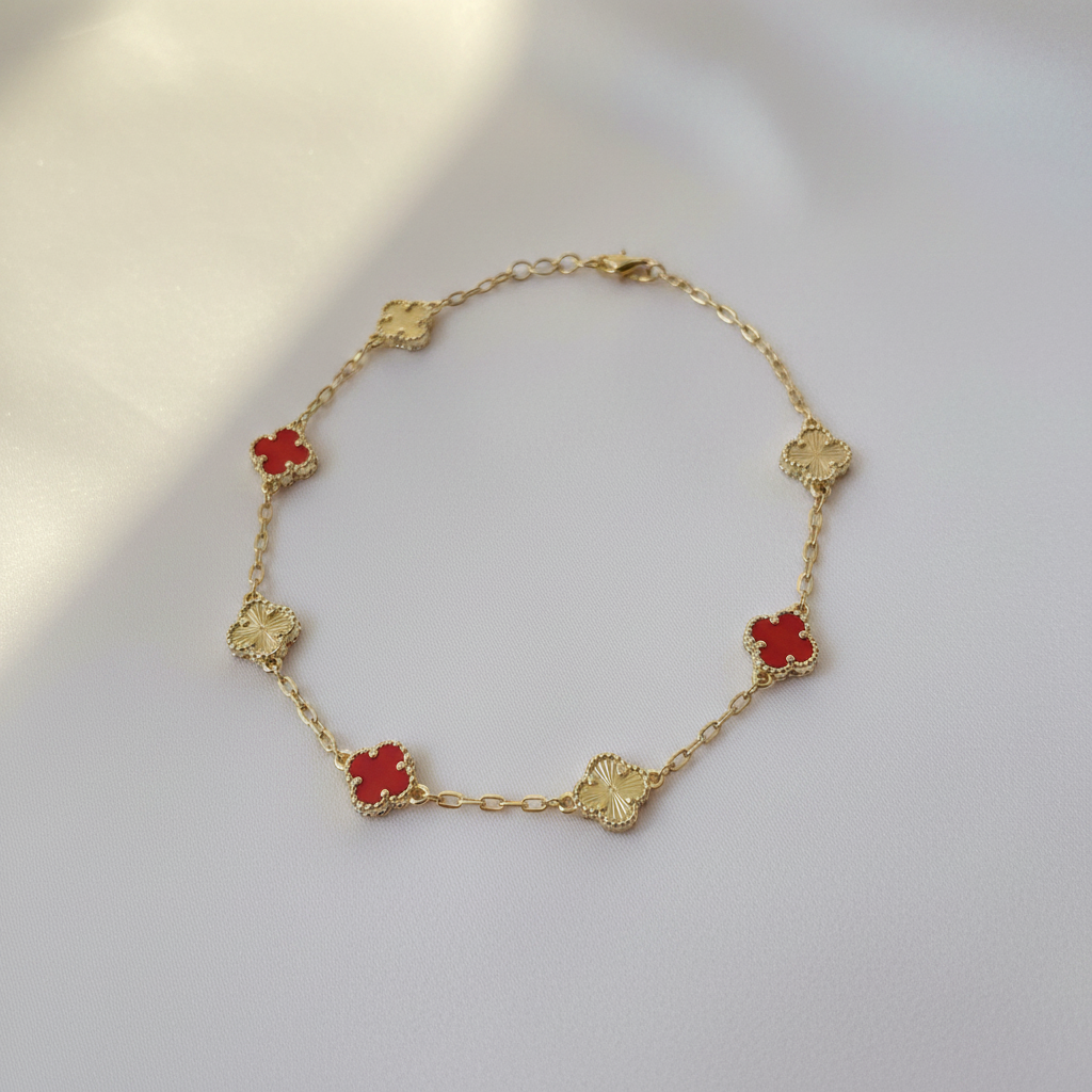 Red & Gold Clover Bracelet Flat Lay